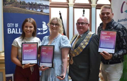 2023 Community Awards winners displaying their awards next to the Mayor Cr Des Hudson