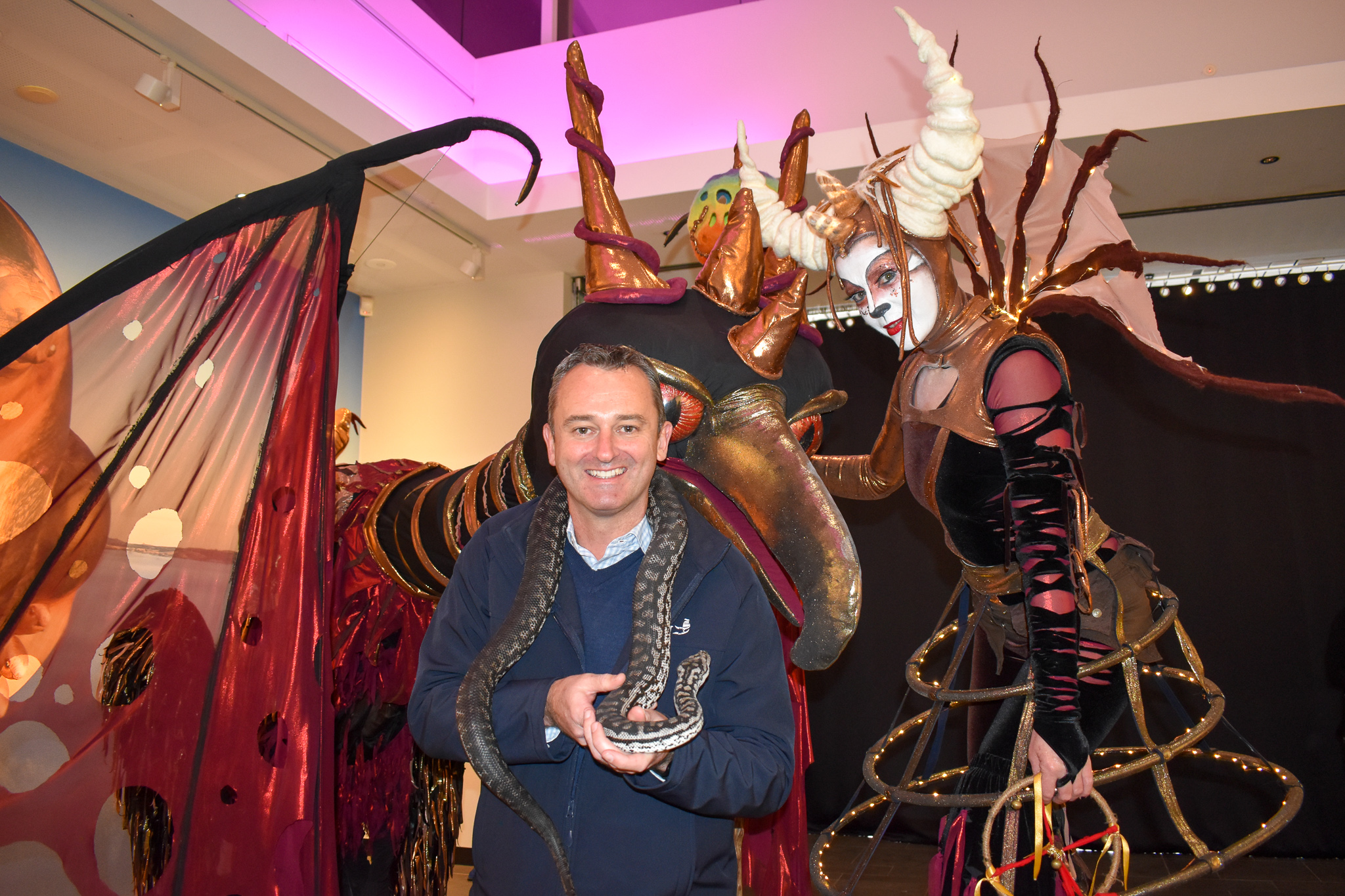 Ballarat Mayor Cr Daniel Moloney with Jeffrey the snake and Beyond Dark characters from Ballarat Winter Festival