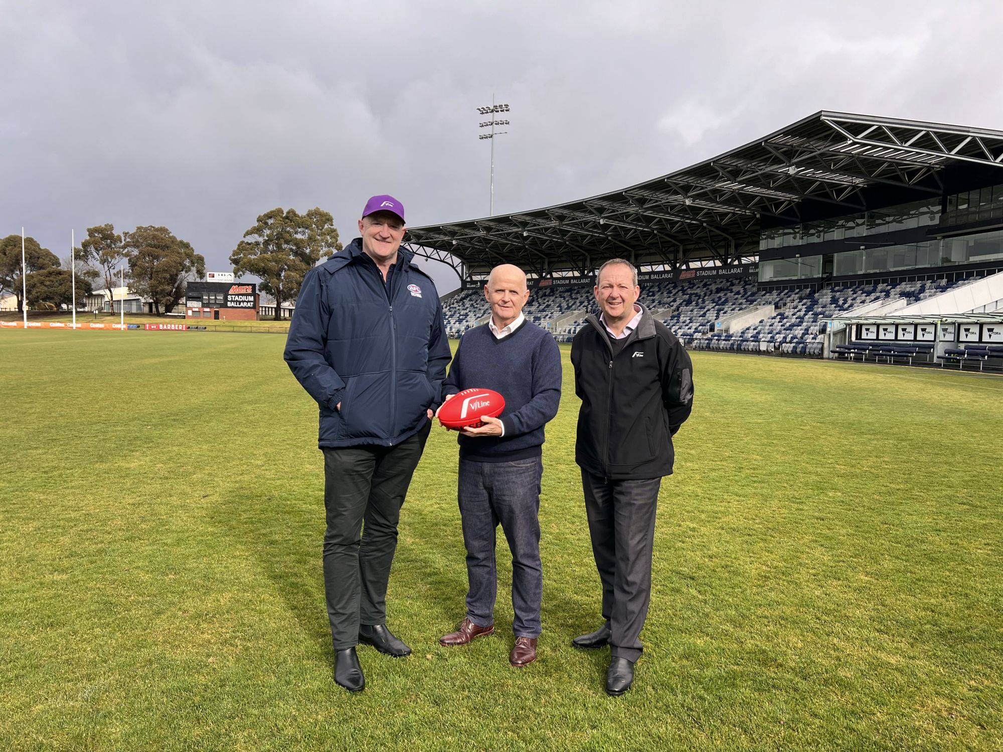 Head of AFL Victoria Greg Madigan, City of Ballarat Deputy Mayor Cr Peter Eddy, V/Line Acting CEO Jonathon McKeon at Mars Stadium.