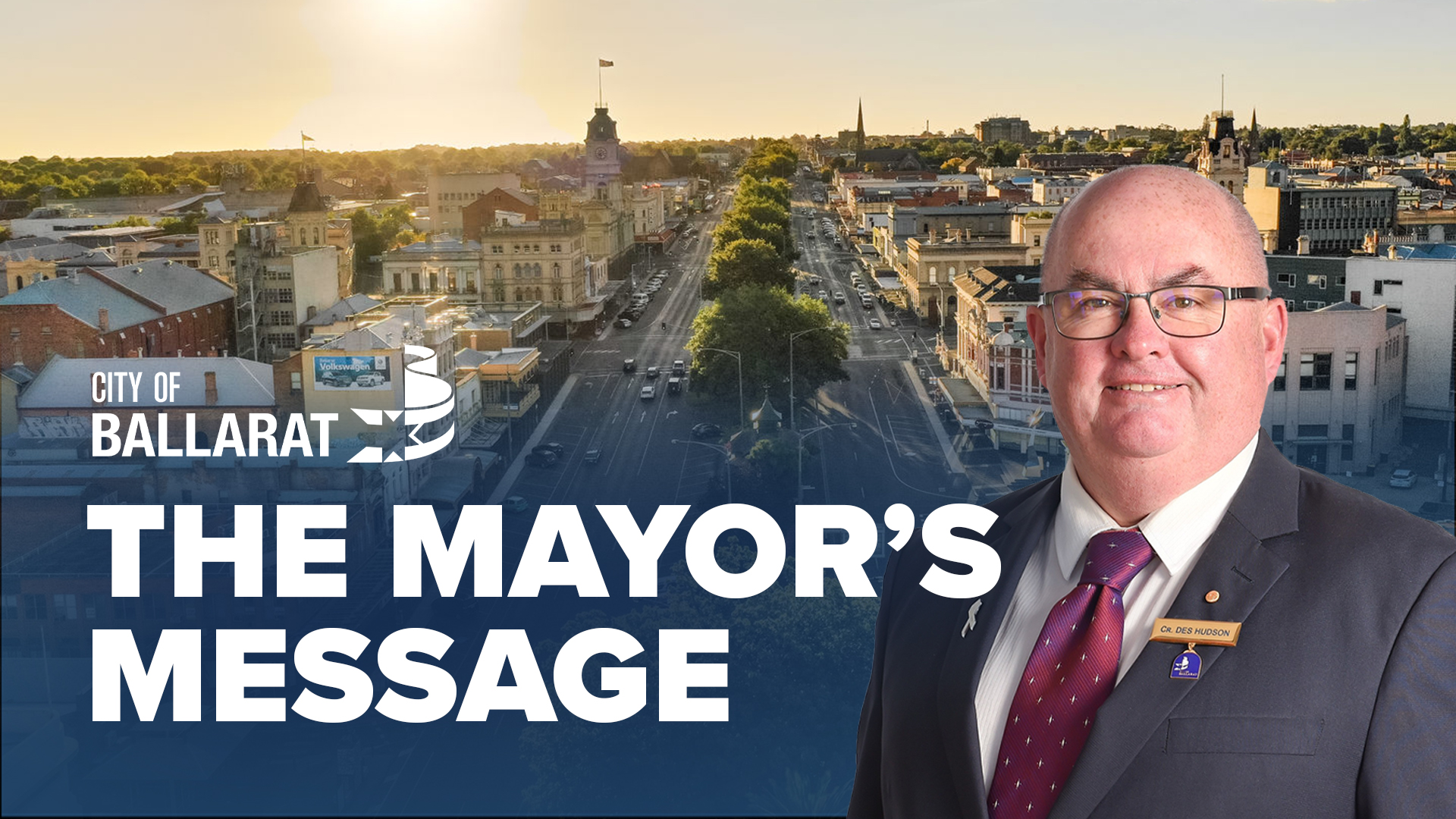 Text with The Mayor's Message with an image of Mayor Cr Des Hudson in front of an aerial view of Ballarat