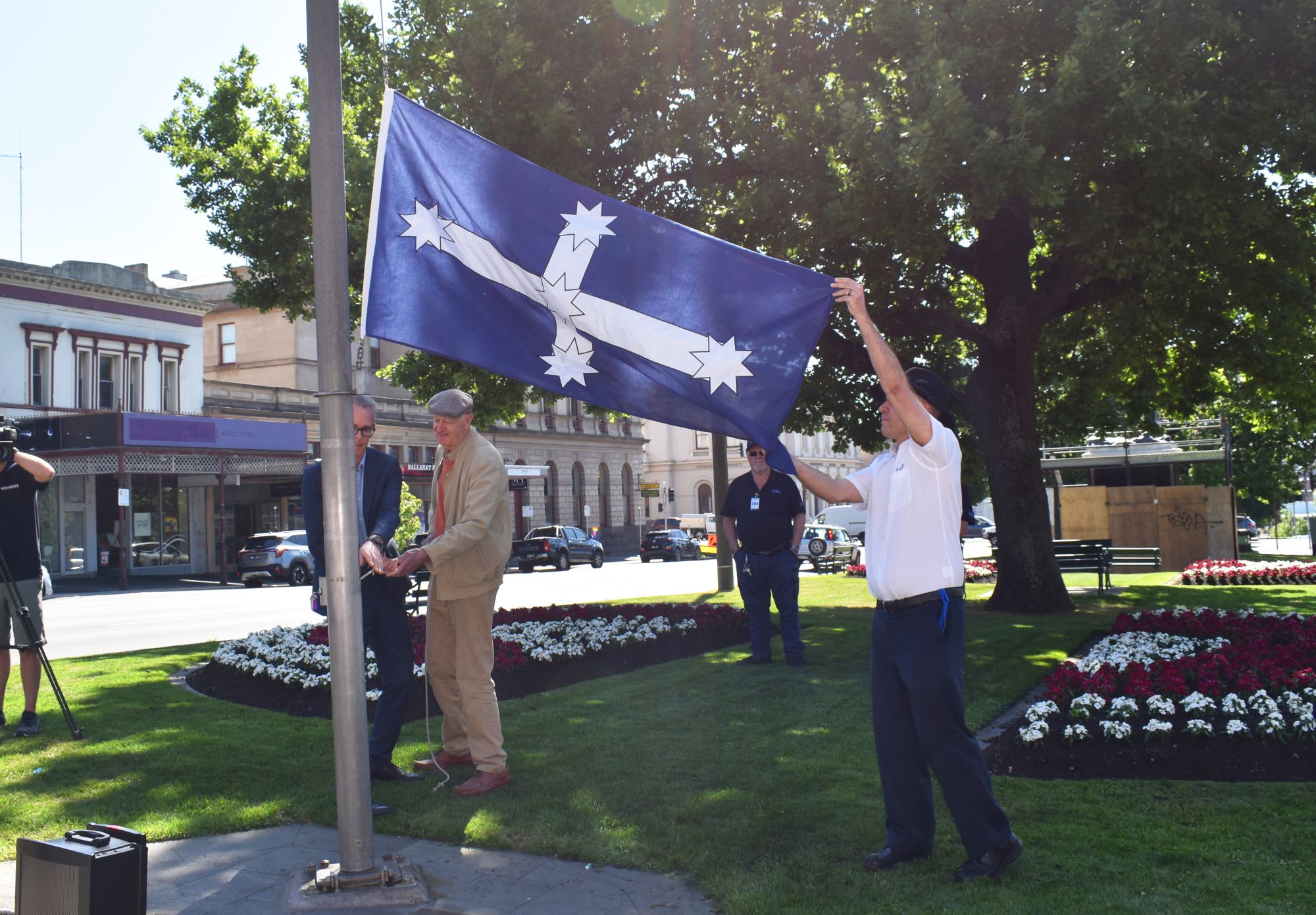 Eureka descendant Phillip Moore helping raise the Eureka Flag.