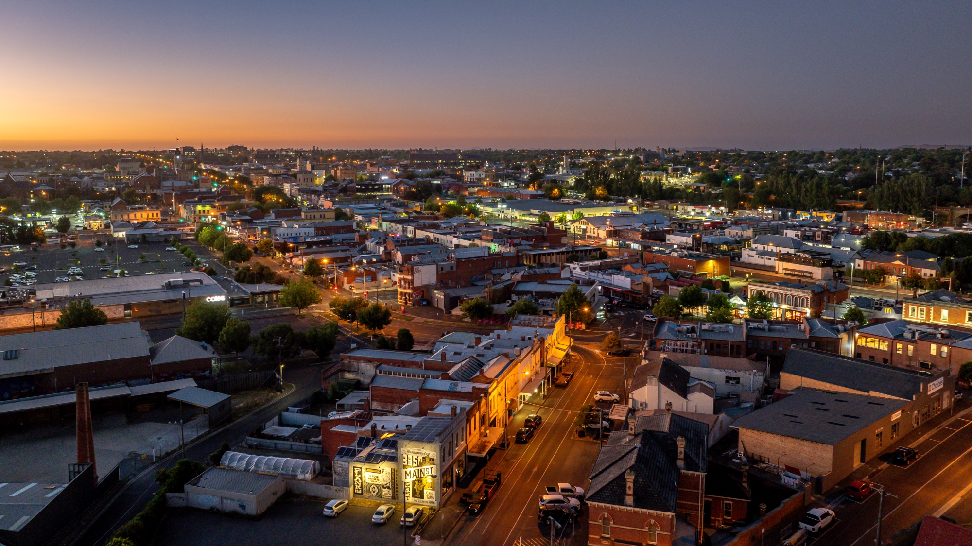 An aerial image of Main Road, Bakery Hill in the early evening. 