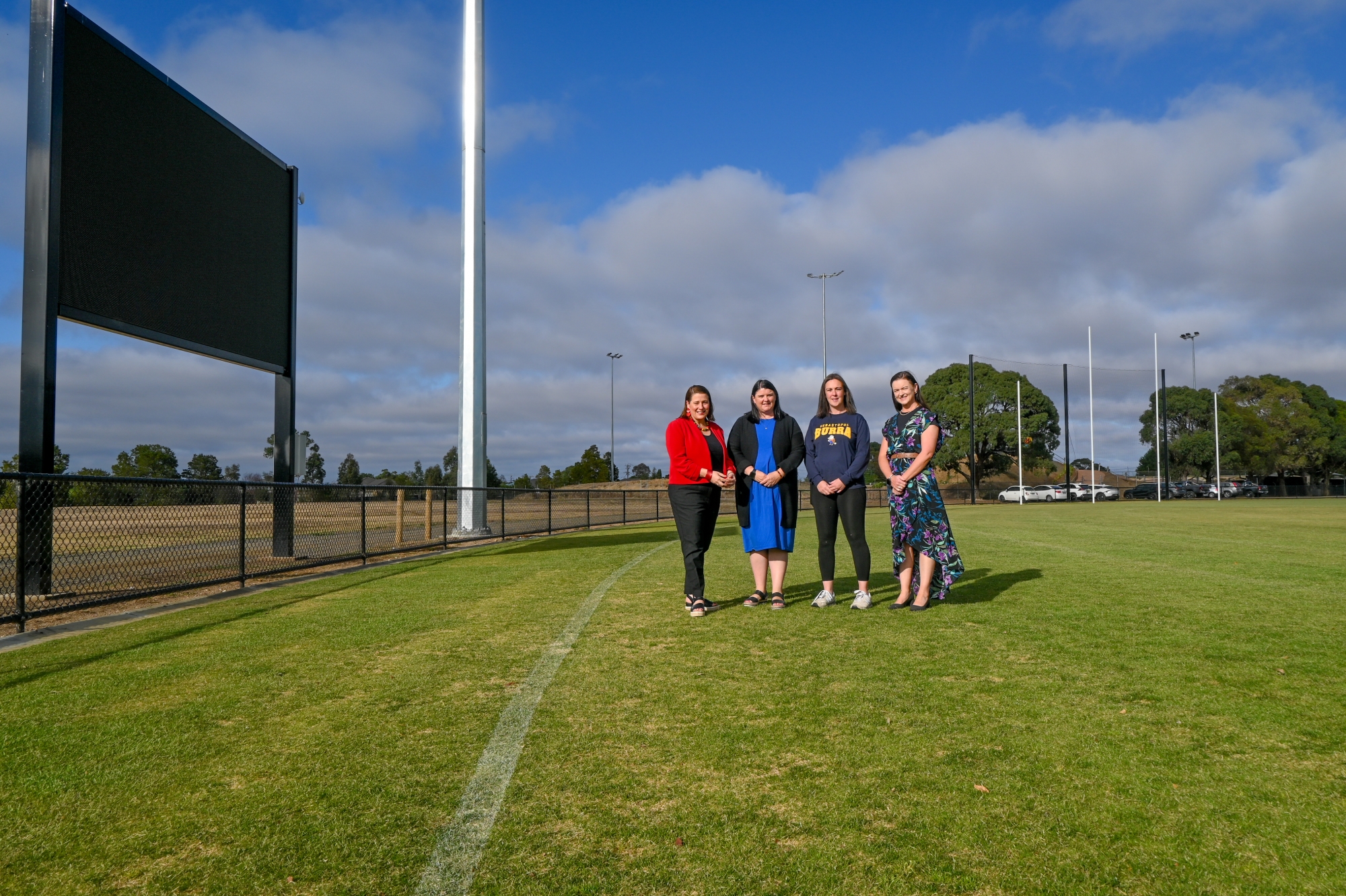 In front of the new scoreboard is (L-R) Member for Wendouree, Juliana Addison, Napoleons-Sebastopol Cricket Club President, Danielle Riding, Sebastopol Football and Netball Club President, Chenay Wilkinson and City of Ballarat Mayor, Cr Tracey Hargreaves.