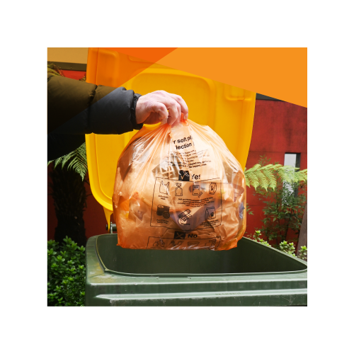 Image of the soft plastic trial supplied bag filled and going in the bin