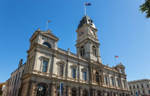 Ballarat Town Hall stands against a clear blue sky. 