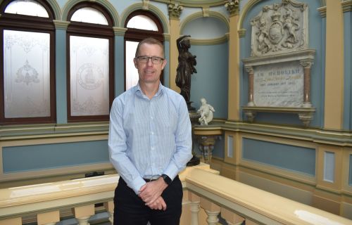 Image of CEO Evan King upstairs in the Town Hall on Sturt Street smiling to camera