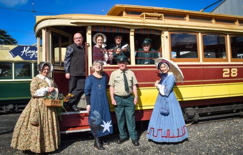 Mayor on tram with Sovereign Hill representatives in period costumes
