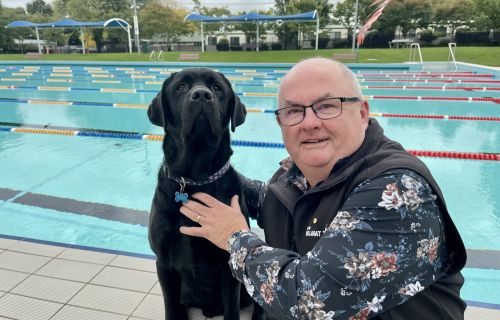City of Ballarat Mayor, Cr Des Hudson with dog Neville at Eureka Pool