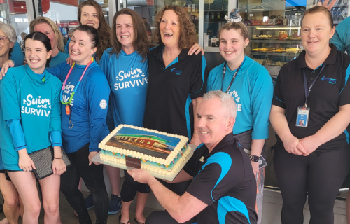 BALC staff with a celebratory cake to celebrate winning Victorian Swim Centre of the Year for its ‘Learn to Swim’ program