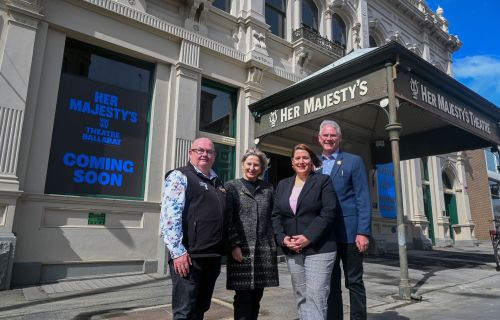 Photo of Mayor with Government representatives in front of Her Majesty's Theatre