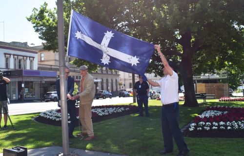 Eureka descendant Phillip Moore helping raise the Eureka Flag.