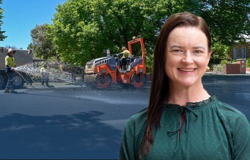 Image of Mayor Cr Tracey Hargreaves with a photo of roadworks taking place behind her