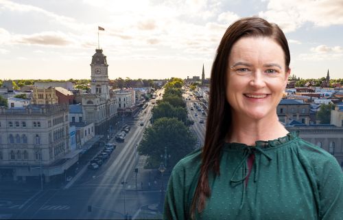 Image of Mayor Cr Tracey Hargreaves in front of an image of aerial view of Sturt Street, Ballarat