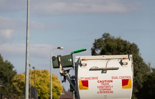 A bin is emptied into the waste collection vehicle