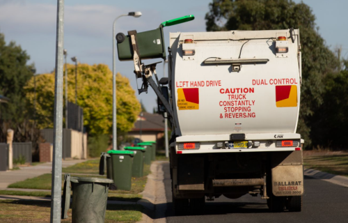 A bin is emptied into the waste collection vehicle