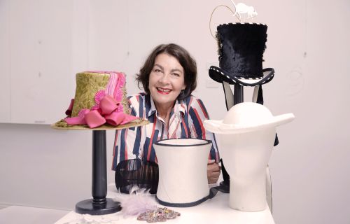 Rose Hudson with the hats she has created