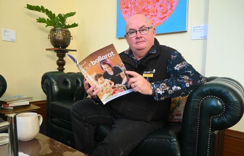 photo of the mayor reading the winter edition of our ballarat