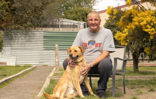 Ian and Bonty sitting together in the backyard