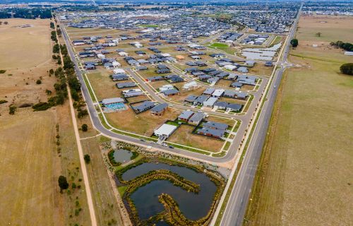 aerial image taken above the western growth area of lucas, also showing the rail trail