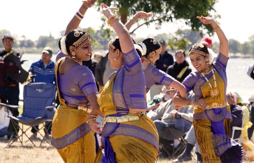 image of ladies performing and traditional clothing