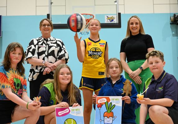 Generic photo group of people at basketball court with healthy food