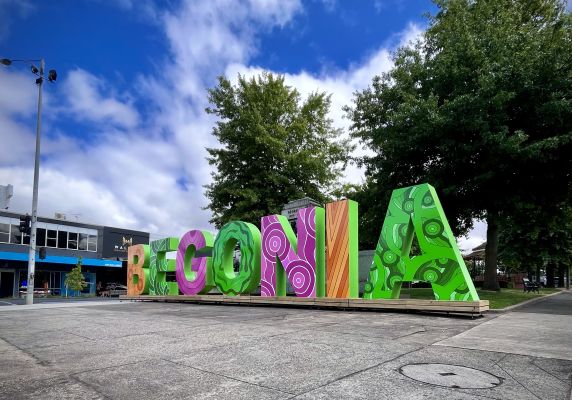 Large, bright letters spelling out 'Begonia' in the centre of Sturt Street. 