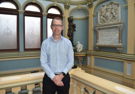 Image of CEO Evan King upstairs in the Town Hall on Sturt Street smiling to camera