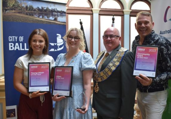 2023 Community Awards winners displaying their awards next to the Mayor Cr Des Hudson