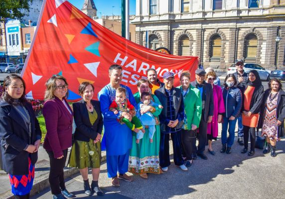 The Harmony Day flag raising in Queen Victoria Square.