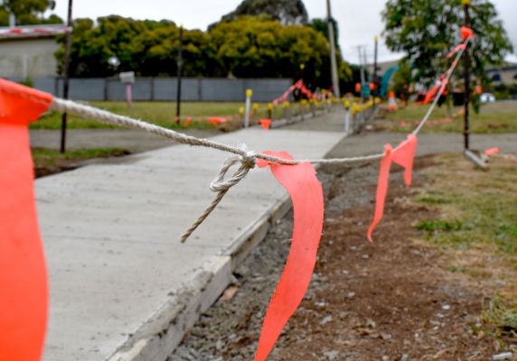 New footpath with orange bunting around it.