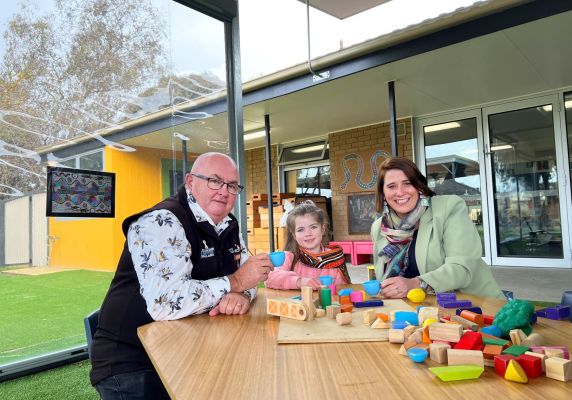 City of Ballarat Mayor, Cr Des Hudson and Member for Wendouree, Juliana Addison with kinder student under the new covered area at the Sebastopol South Kindergarten.