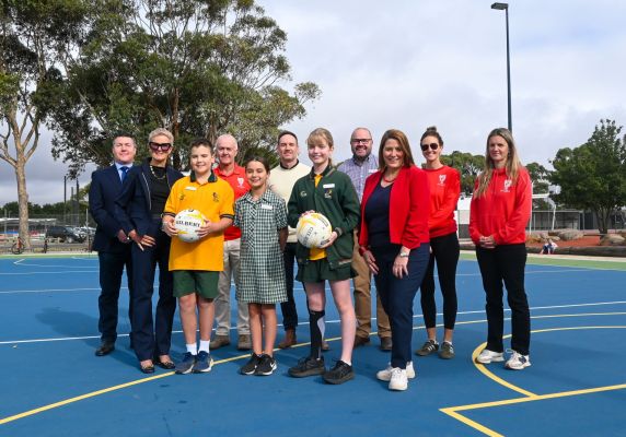 City of Ballarat Cr Damon Saunders and Member for Wendouree Juliana Addison with users of the newly developed Alfredton Primary School netball courts.