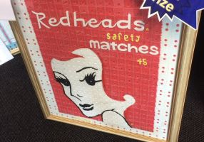The winner of the 2018 open category - a framed image of the Redheads matches logo made from bread tags. 