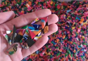 Generic photo hand holding colourful plastic