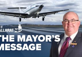 Text with The Mayor's Message with an image of Mayor Cr Des Hudson in front of the Ballarat Airport