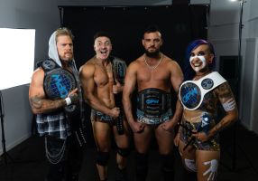 Four wrestlers posing